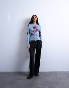 Model wearing Microfibre floral print long sleeve top in blue