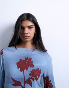 Model wearing Microfibre floral print long sleeve top in blue