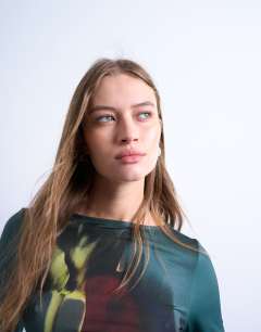 Model wearing Microfibre high neck tulip print top in green