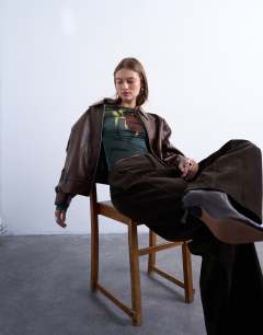 Model wearing Microfibre high neck tulip print top in green