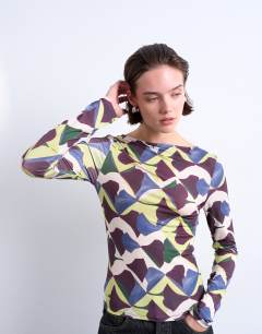 Model wearing Microfibre painted geo print long sleeve top in multi