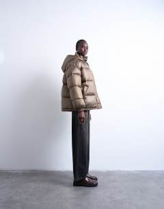 Model wearing Mid length funnel neck puffer jacket in brown
