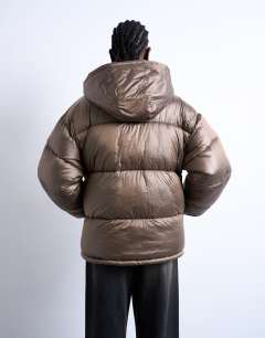 Model wearing Mid length funnel neck puffer jacket in brown