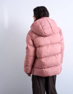 Model wearing Mid length funnel neck puffer jacket in pink