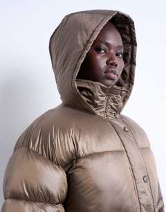 Model wearing Mid length puffer jacket in brown