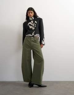 Model wearing Mid rise baggy arc jean in khaki