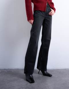 Model wearing Mid rise bootcut jean in washed black