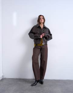 Model wearing Mid rise jean in chocolate