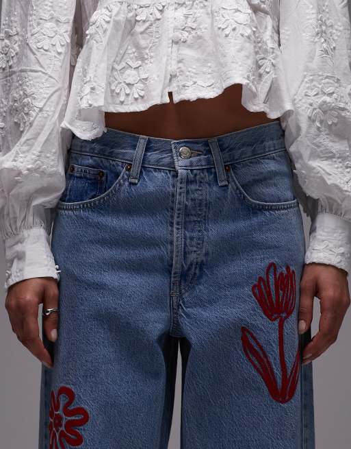 Topshop mid rise loose fit jeans with red floral embroidery in mid blue