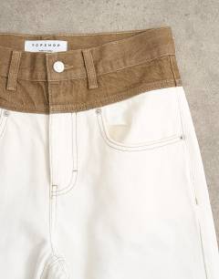 Model wearing Mid rise loose fit two-toned jean in ecru and brown
