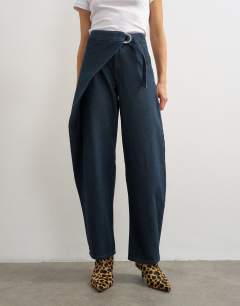 Model wearing Mid rise overlap barrel jean in sulphur blue