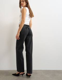 Model wearing Mid rise straight leg jean with lace up detail in washed black