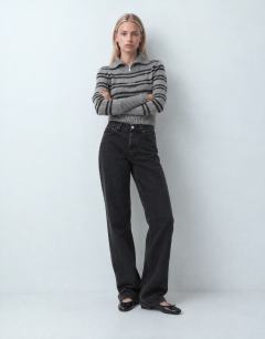 Model wearing Mid rise straight leg jean with lace up detail in washed black