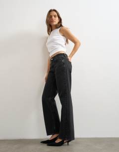 Model wearing Mid rise straight leg jean with lace up detail in washed black