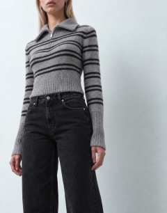 Model wearing Mid rise straight leg jean with lace up detail in washed black