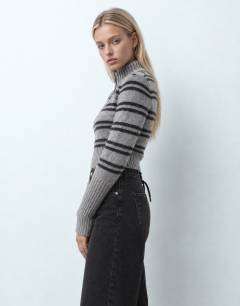 Model wearing Mid rise straight leg jean with lace up detail in washed black