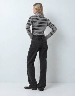 Model wearing Mid rise straight leg jean with lace up detail in washed black