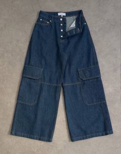 Model wearing Mid rise wide leg jean with utility pocket detail in indigo rinse