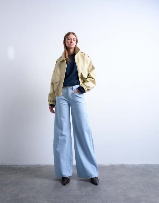Topshop mid rise wide leg jeans with frayed hem in bleach