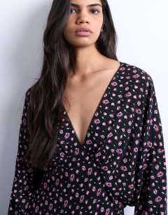 Model wearing Midi long sleeve tea dress in floral print