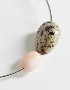 Model wearing Mila choker necklace with pink and dalmatian stones