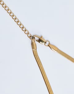 Model wearing Mila waterproof stainless steel 2 pack snake chain necklace in gold