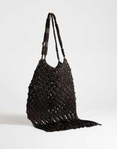 Model wearing Milan medium crochet tassel bag in chocolate
