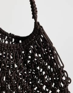 Model wearing Milan medium crochet tassel bag in chocolate