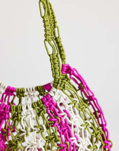 Model wearing Milan medium crochet tassel bag in khaki stripe