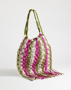 Model wearing Milan medium crochet tassel bag in khaki stripe