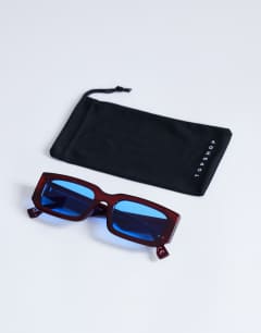 Model wearing Milan rectangle sunglasses in burgundy