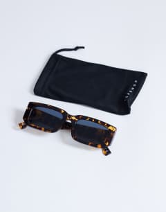 Model wearing Milan rectangle sunglasses in tortoise