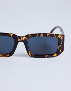 Model wearing Milan rectangle sunglasses in tortoise