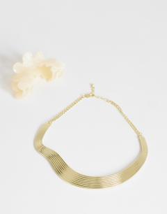 Model wearing Miles statement choker necklace in gold