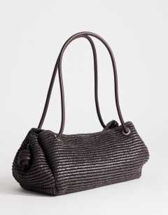 Model wearing Miller large straw shoulder bag in chocolate