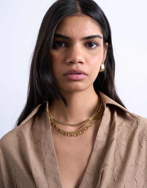 Topshop – Mina – Guldfärgat halsband i vattentåligt, rostfritt stål med flera kedjor