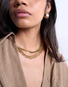 Model wearing Mina waterproof stainless steel multirow chain necklace in gold