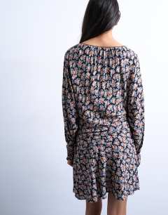 Model wearing Mini long sleeve tea dress in floral print