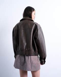 Model wearing Mini poplin skirt in brown and blue stripe