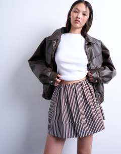 Model wearing Mini poplin skirt in brown and blue stripe