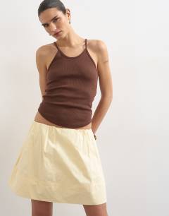 Model wearing Mini poplin skirt in buttermilk