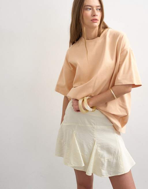 Topshop - Minigonna color crema con godet sul fondo