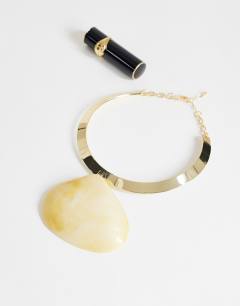 Model wearing Mira statement necklace with shell pendant