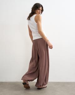 Model wearing Modal balloon leg trousers in chocolate