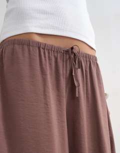 Model wearing Modal balloon leg trousers in chocolate