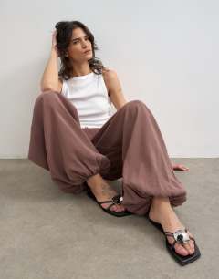 Model wearing Modal balloon leg trousers in chocolate