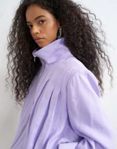 Model wearing Modal funnel neck jacket in lilac