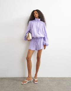 Model wearing Modal funnel neck jacket in lilac