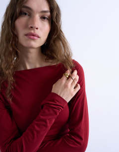 Model wearing Modal ruched slash neck long sleeve top in dark red
