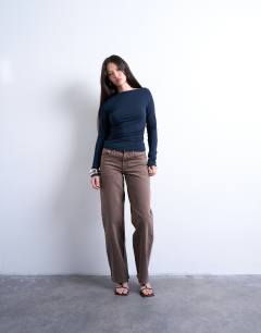 Model wearing Modal ruched slash neck long sleeve top in navy